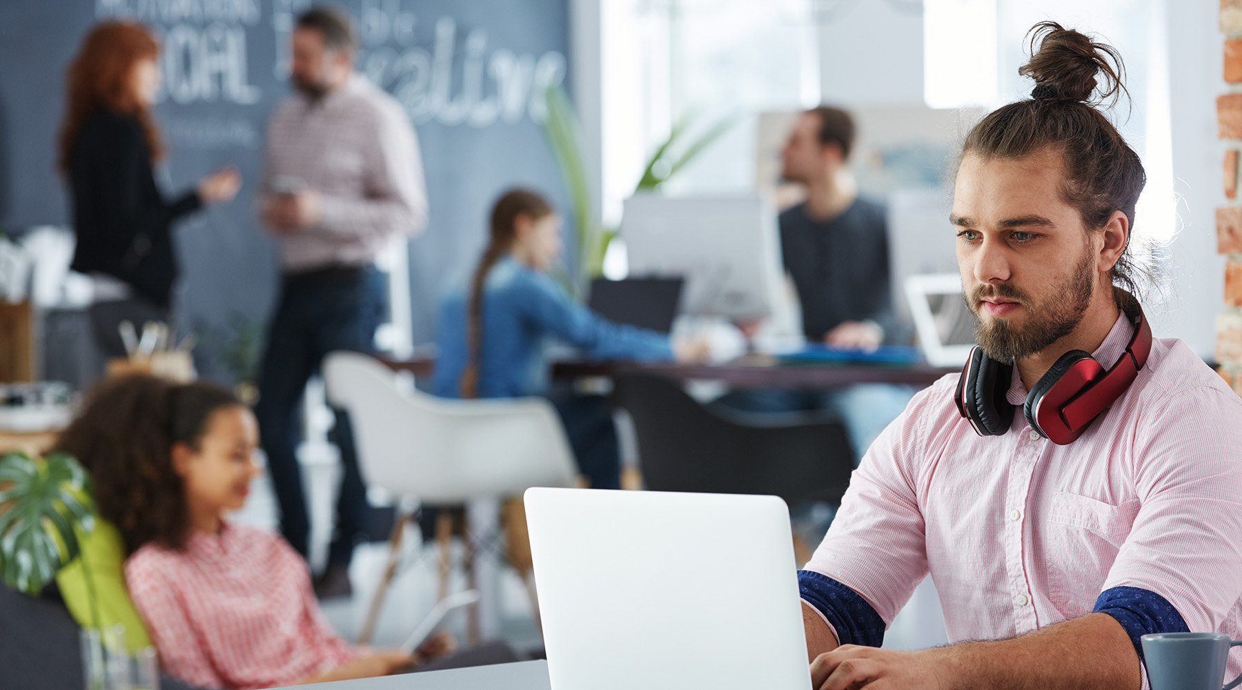 Confident man working on startup